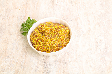 Grain mustard sauce in the bowl