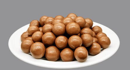 Maltesers chocolate balls on a plate - Powered by Adobe
