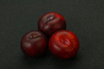 Ripe sweet plum fruit heap