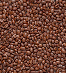 Top view, flat lay background of roasted coffee beans.