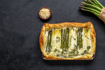 Homemade shortcrust quiche made with green and white asparagus, cream, and parmesan cheese....