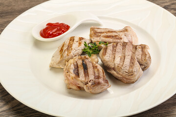 Grilled pork tenderlion with tomato sauce