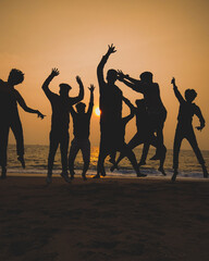 silhouettes of dancing friends