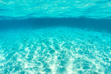 Fototapeta na wymiar Underwater of tropical; sun rays passing through water.