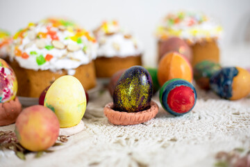 easter colorful eggs on vintage tablecloth, easter preparation for the holiday top view