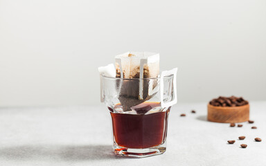 Drip coffee bag in a mug. Trends in brewing coffee at home.