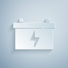 Paper cut Car battery icon isolated on grey background. Accumulator battery energy power and electricity accumulator battery. Paper art style. Vector