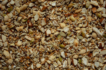 Nut and seed mix before cooking, close up view background. Macro image.