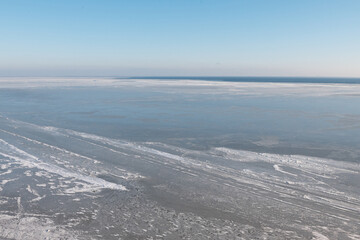 Aerial view of frozen Dnieper estuary covered with ice. Stanislav, Ukraine.