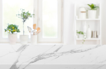 Marble texture table top on blurred kitchen window interior background