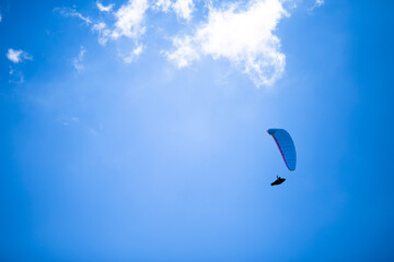 paragliding in the blue sky