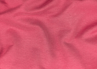 Pink jersey fabric matte texture top view. Red coral knitwear satin background. Fashion color feminine clothes trend. Female blog backdrop text sign design. Girly abstract wallpaper textile surface.