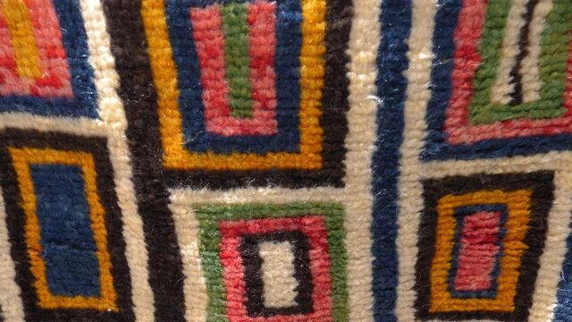 Colorful Moroccan Berber carpet with modern design. Moroccan design abstract background footage.
