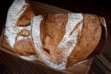 Sliced bread on a wooden cutting board. art bread.
