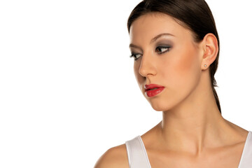  woman with blue eyes and makeup looking aside