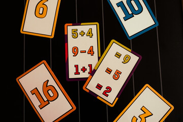 cards with numbers on a blackboard