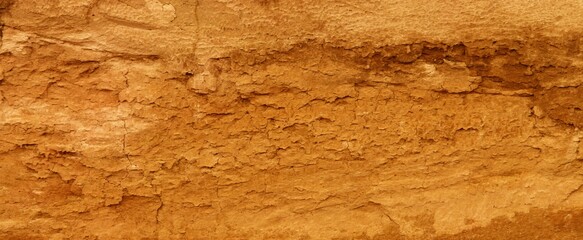 Grunge wall texture background. Paint cracking off dark wall with rust underneath.