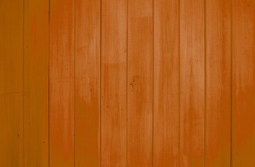 Holzwand aus Brettern mit orange brauner Farbe