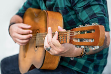 Guitars acoustic. Live music. Music festival. Male musician playing guitar, music instrument. Man's...