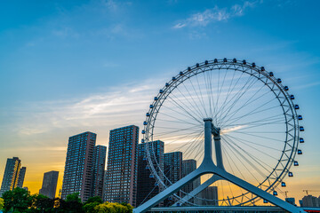 Fototapeta premium Tianjin eye Ferris wheel modern steel structure building