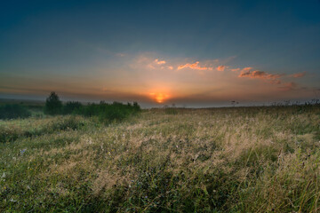 sunrise over the field in central russia