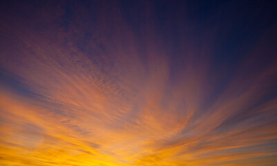 Obraz premium Beautiful sunset. The fiery yellow glow of the sky above the horizon at sunset.