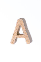 Letter A of the sand isolated in white. summer concept. alphabet.