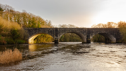 Fototapeta na wymiar Threave Bridge over the River Dee near Castle Douglas, on a sunny winters day