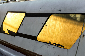 Sun reflected in the windows of a fishing boat