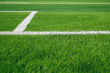 Artificial grass of football field with white stripe, Soccer corner line detail, Green astro turf...