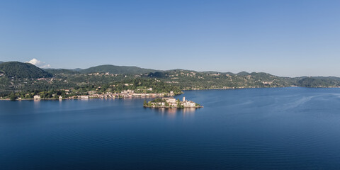 Panoramic landscape of Orta San Giulio and San Giulio island on Lake Orta.