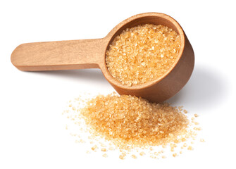 yellow sanding sugar in the wooden measuring spoon, isolated on white background