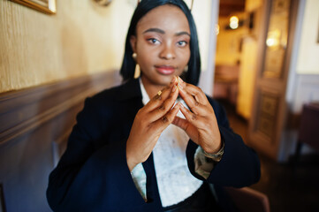 Young deaf mute african american woman using sign language.