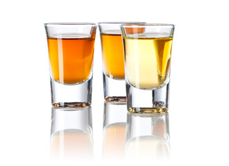 Three Shot Glasses With Different Spirits on white background - 436179567