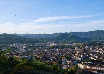 views of the city of olot, at dawn from the top of the Montsacopa volcano, in the province of girona, catalonia.