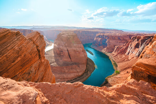 Panorama of Horseshoe Bend in Page, Arizona. The Colorado River and a land mass made of orange sandstone