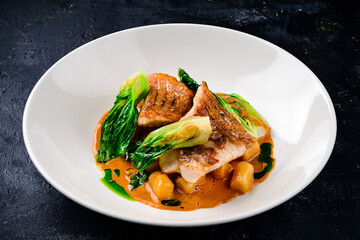 Snapper fish steak in white plate