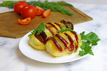 potato stuffed with salami, cheese, ketchup, garlic and herbs. Baked whole potatoes is sliced and stuffed