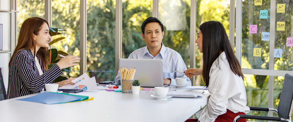 Group of  business people wearing formal clothes sitting around working table. Meeting talking discussing listening about company business to the colleague in the office