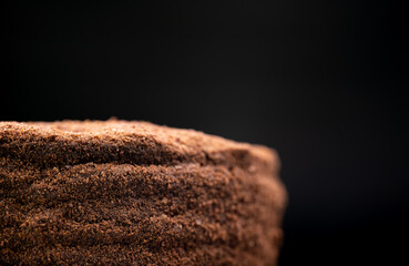 Delicious cake on black background