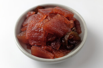 Pickled radish cucumbers on a white background
