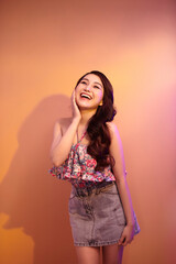 High Fashion model woman in colorful bright neon lights posing in studio, night club