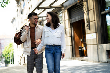  Happy young couple outdoors. Loving couple walking in the city