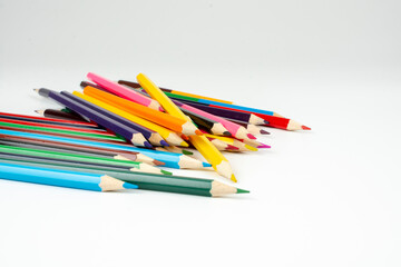a stack of wooden colored pencils for drawing