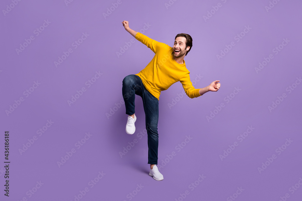 Poster full length body size view of attractive cheerful man dancing having fun isolated over pastel violet