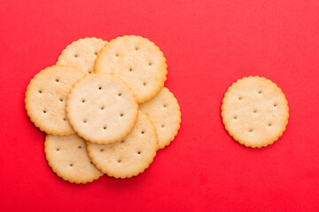 cracker close-up. salty cracker on a red background