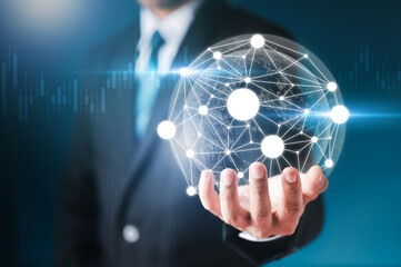 Business man holding Earth 3D Holographic projection represents the growing path of information, network, technology and business communication.