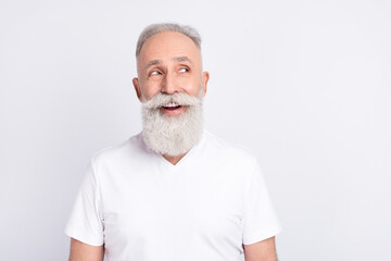 Portrait of funny grey hair old man look empty space wear white t-shirt isolated on grey color...