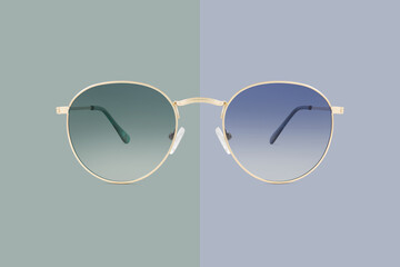 sunglasses golden metallic frame and green and blue polarized lenses isolated on background