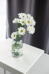 Flowers in vase in home interior